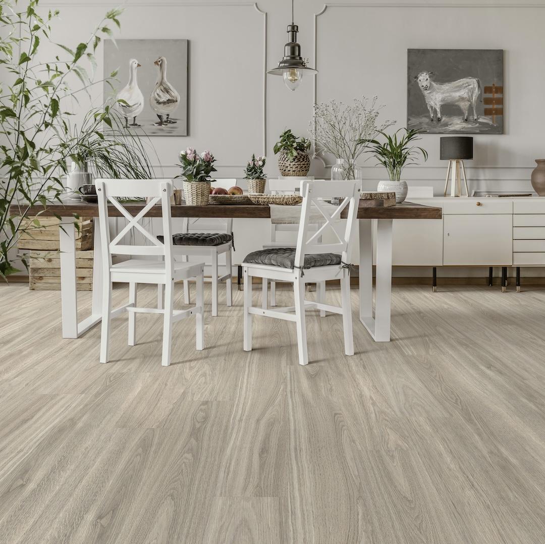 White chairs at table with flowers in rustic dining room on elkton oak floors